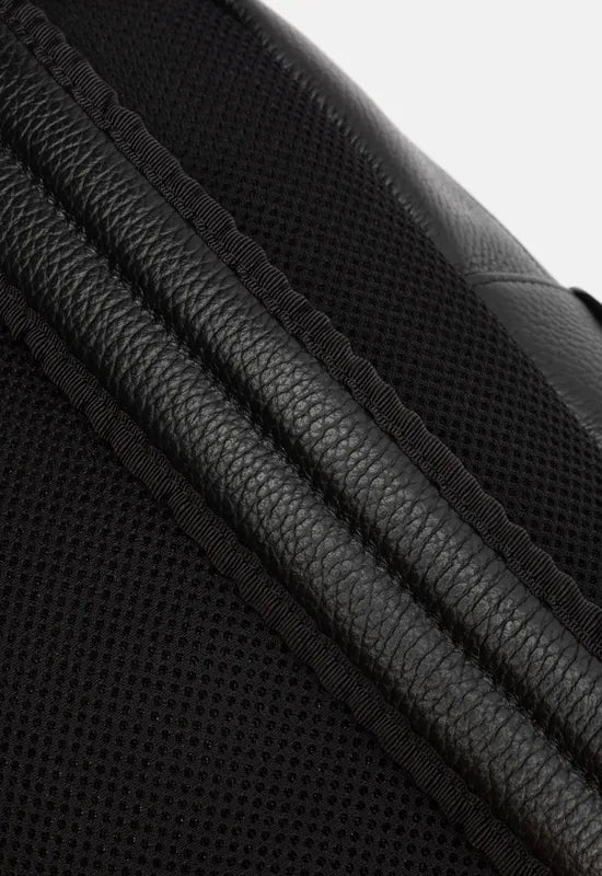 This isn't your typical rucksack. The 'Colville' backpack is a big step up from the polyester backpacks of your school years. Made from leather with a faux suede interior, this backpack will look sophisticated no matter where you're going. The back panel as well as the inside of the straps are made from an aerated mesh material that is cushioned and breathable, making it comfortable when you're lugging around your laptop, books, sketches, and personal belongings. You'll be able to fit quite a bit insid