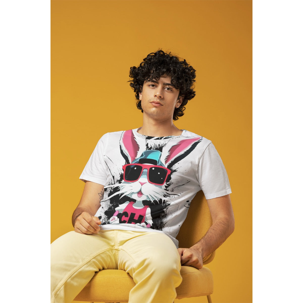 Meet your new go-to tee! This Badder Bunny graphic tee combines comfort with personality. Crafted from a breathable jersey blend (95% polyester, 5% spandex), it's soft against your skin and built to last. The relaxed regular fit and classic round neck make it perfect for everyday wear—whether you're lounging or heading out. At 180 g/m², the fabric has just the right weight for year-round comfort. Machine wash cold, tumble dry low, and you're set for countless wears.