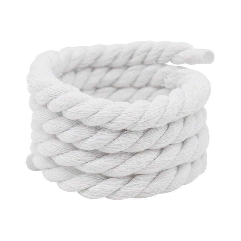 Coiled white rope shoelace on a white background