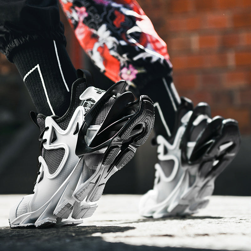 Black and white athletic shoes with a brick wall background