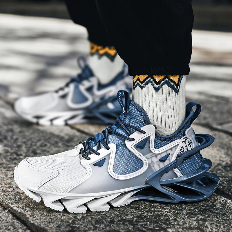 White and blue sneakers with a person wearing them on a pavement.
