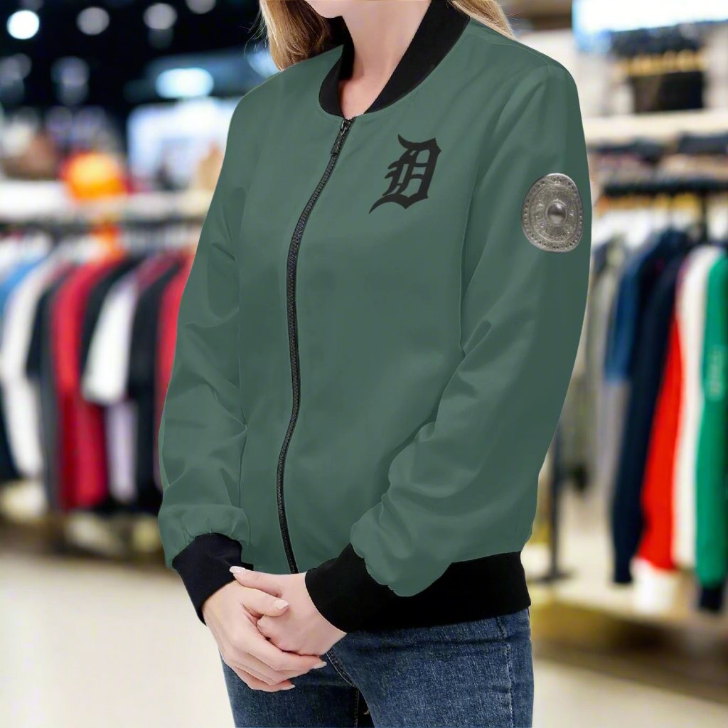 Indulge in luxury with the Classic Money Green Detroit D's Women’s Bomber Jacket. Handmade with premium polyester blend fabric and soft polyester lining, this jacket guarantees a comfortable wear. The reinforced cuffs and waist add durability, while the 2 spacious front pockets provide essential storage. Complete with an exquisite design and zipper-up closure, this jacket exudes elegance and sophistication. Care for it with gentle machine wash and low-heat tumble dry.