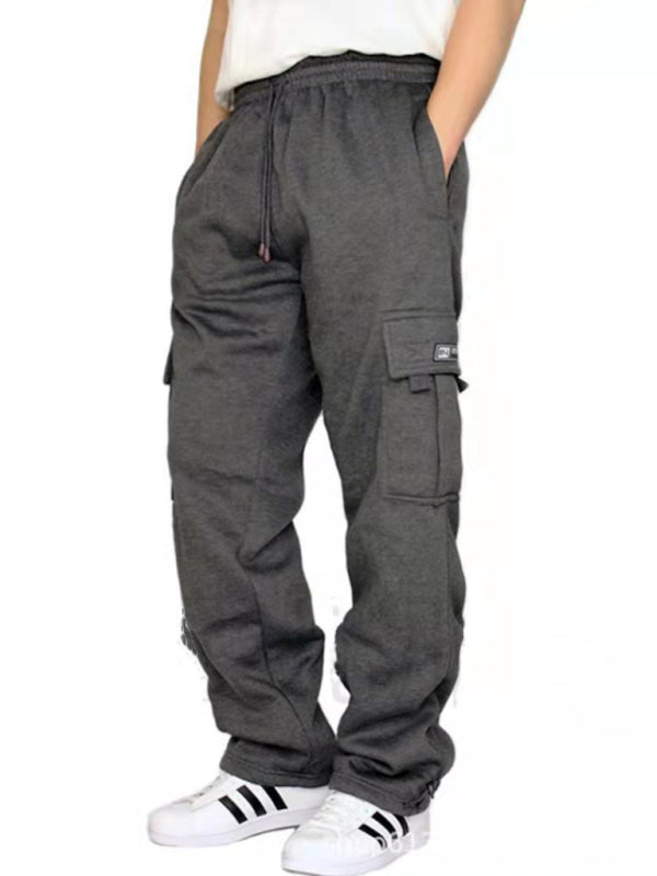 Elevate your style with our Multi-pocket men's baggy jogging pants. Made from premium 100% polyester, these pants are perfect for all four seasons. With a self design pattern and flap pockets, they offer both practicality and sophistication. Mix and match with our Black Friday Christmas Bundle 5 for $100 for a versatile and stylish wardrobe. The perfect blend of comfort and elegance for any occasion.