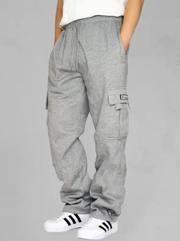 Elevate your style with our Multi-pocket men's baggy jogging pants. Made from premium 100% polyester, these pants are perfect for all four seasons. With a self design pattern and flap pockets, they offer both practicality and sophistication. Mix and match with our Black Friday Christmas Bundle 5 for $100 for a versatile and stylish wardrobe. The perfect blend of comfort and elegance for any occasion.