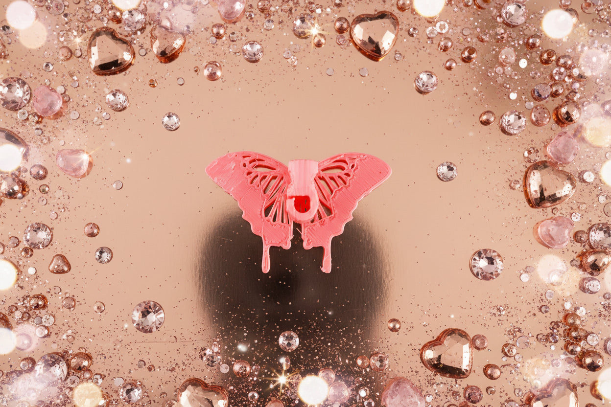 Butterfly Bling is the shoe charm that keeps collectors coming back. Each iridescent design sparkles with peacock blue rhinestones that shift and shimmer with every step—making it the perfect tradable collectible. Build your charm collection, swap with friends, or hunt for rare variations. Crafted with non-toxic glue and durable 2-3mm rhinestones, it measures 2.5" wide by 2" long. Available fully blinged or plain, with separate bling kits to customize your style. Start your collection today.