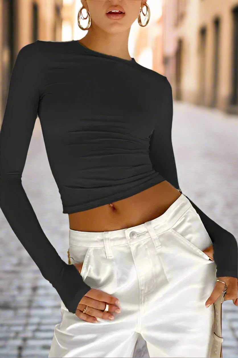 Elevate your wardrobe with our Women's solid color long-sleeved top from the Black Friday Christmas Bundle. Made with high-quality material and slight elasticity, it offers comfort and style for all seasons. Choose from a range of sizes for a perfect fit. Make a statement with our versatile and chic top.