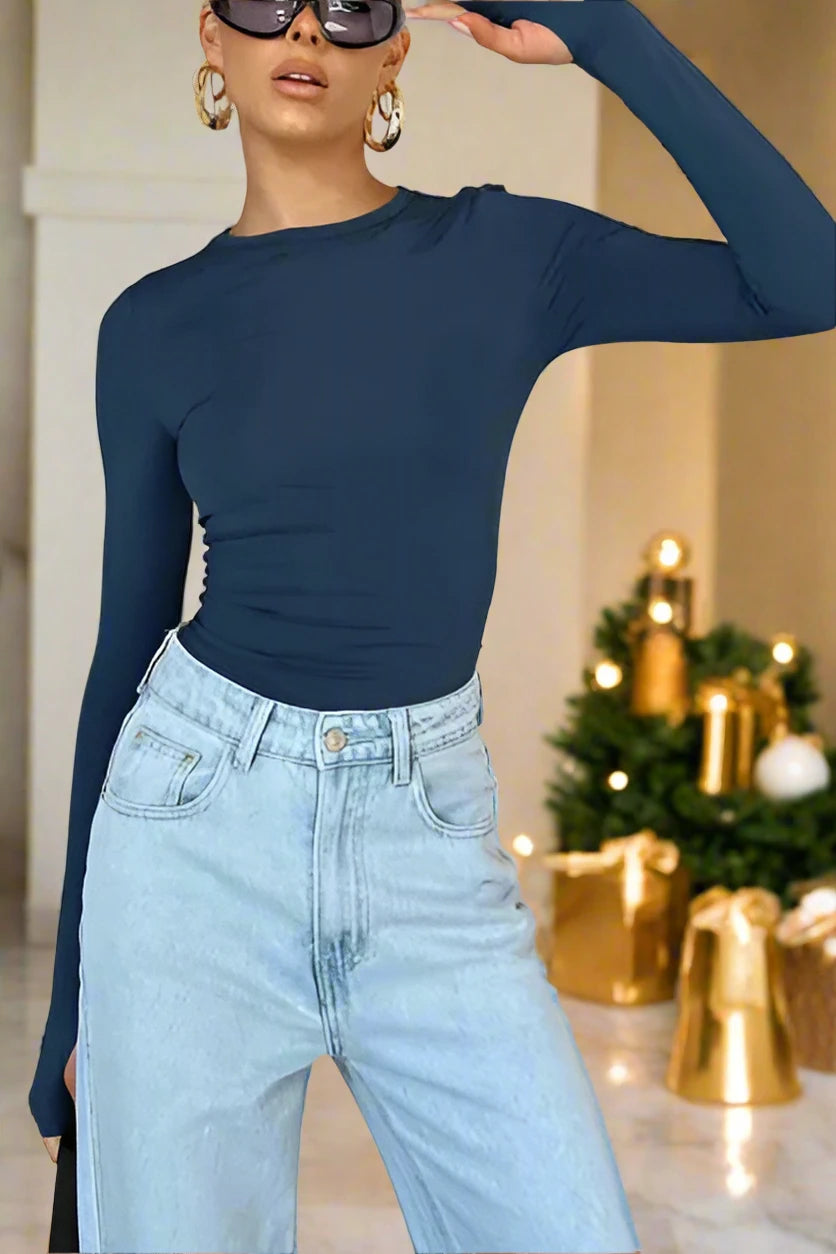 Elevate your wardrobe with our Women's solid color long-sleeved top from the Black Friday Christmas Bundle. Made with high-quality material and slight elasticity, it offers comfort and style for all seasons. Choose from a range of sizes for a perfect fit. Make a statement with our versatile and chic top.