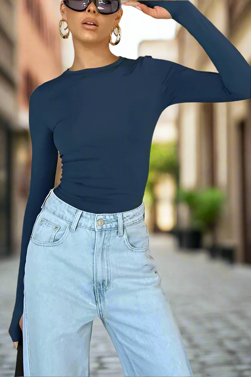 Elevate your wardrobe with our Women's solid color long-sleeved top from the Black Friday Christmas Bundle. Made with high-quality material and slight elasticity, it offers comfort and style for all seasons. Choose from a range of sizes for a perfect fit. Make a statement with our versatile and chic top.