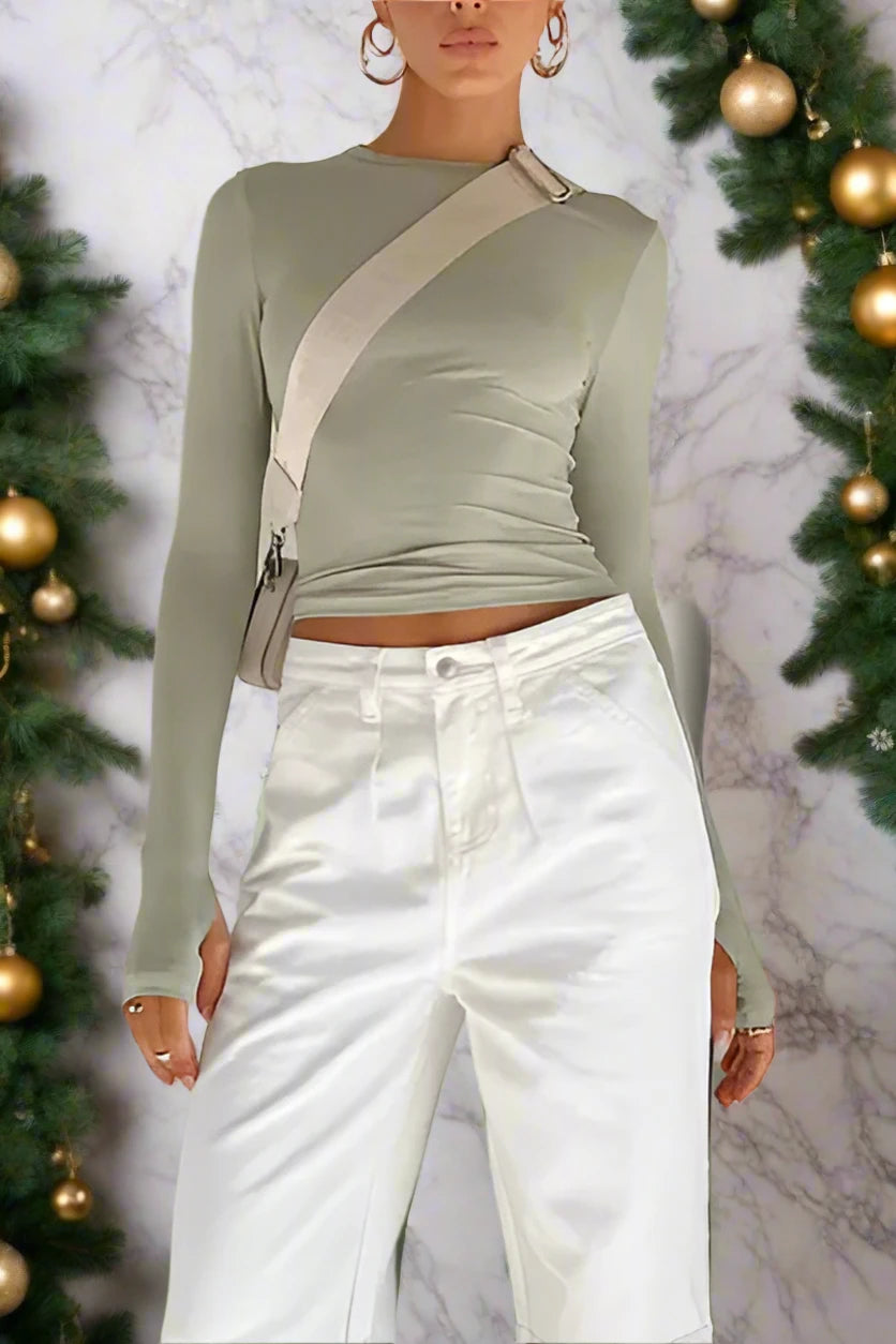 Elevate your wardrobe with our Women's solid color long-sleeved top from the Black Friday Christmas Bundle. Made with high-quality material and slight elasticity, it offers comfort and style for all seasons. Choose from a range of sizes for a perfect fit. Make a statement with our versatile and chic top.